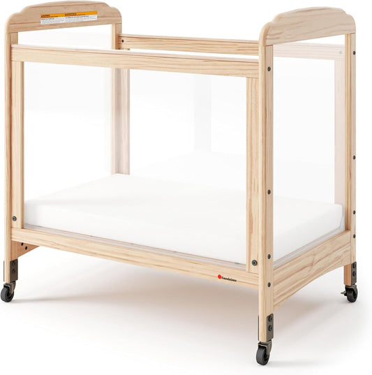 Foundations Serenity Compact Clearview Daycare Crib, Fixed Side, Durable Wood Construction, Non-Marking Casters (2 Locking), Includes 3” InfaPure Foam Mattress (Natural)
